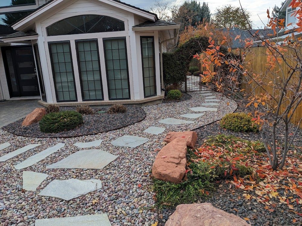 Landscaped flagstone path and garden beds at a Boise home — Green Lawn Care portfolio photo